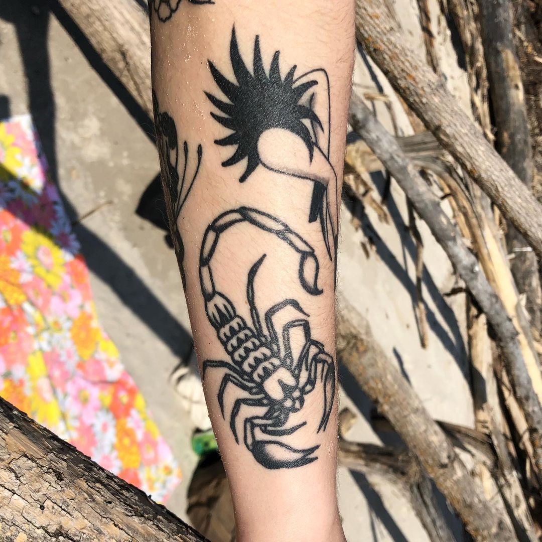 Traditional scorpion tattoo on the right hand